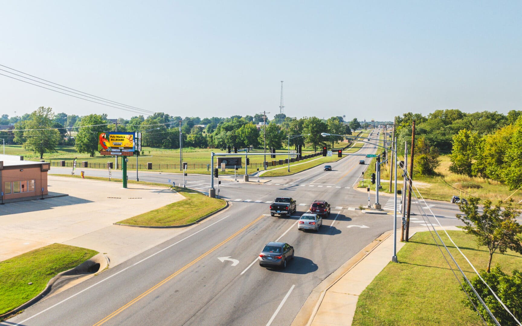A view of cars driving down the street.